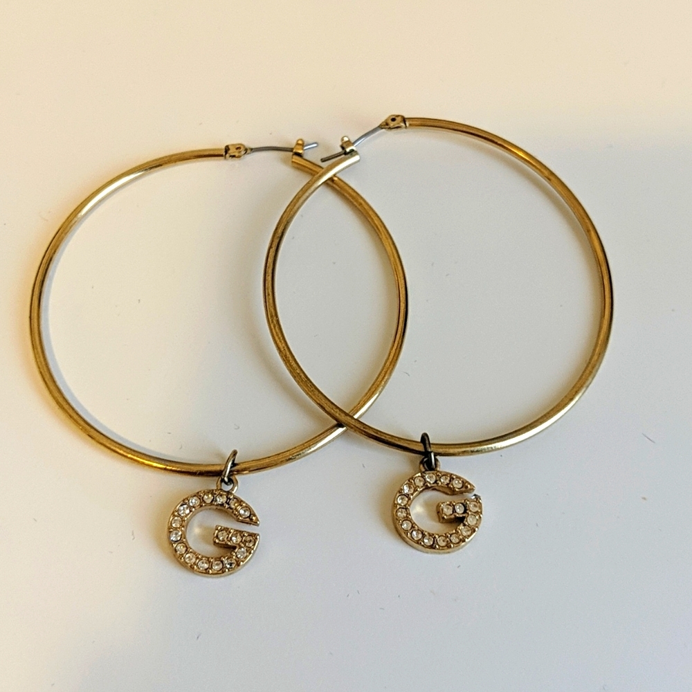 Guess ear rings